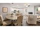 A combined dining and living area with modern fireplace and lots of natural light at 5615 Hislop Ln # 82, Mableton, GA 30126