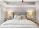 The main bedroom offers a tray ceiling and decorative lamps at 5615 Hislop Ln # 82, Mableton, GA 30126