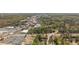 An aerial view showcases the neighborhood's layout, with trees, businesses, and residential areas visible at 6795 Brandon Mill Rd, Atlanta, GA 30328