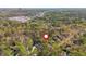 Aerial shot of the property nestled among mature trees, with a view of the surrounding neighborhood and cityscape at 6795 Brandon Mill Rd, Atlanta, GA 30328