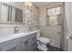 Charming bathroom with grey vanity, marble countertop, decorative wallpaper, and neutral accents at 6795 Brandon Mill Rd, Atlanta, GA 30328