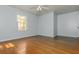 Large bedroom with lots of light, neutral paint, and hardwood floors at 6795 Brandon Mill Rd, Atlanta, GA 30328
