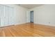 Bedroom features hardwood floors and a double-door closet for ample storage at 6795 Brandon Mill Rd, Atlanta, GA 30328