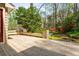 Charming outdoor wooden deck area overlooking the landscaped backyard and greenery at 6795 Brandon Mill Rd, Atlanta, GA 30328