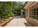 Spacious wooden deck perfect for outdoor entertaining with mature trees and landscaping at 6795 Brandon Mill Rd, Atlanta, GA 30328