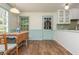 Cozy dining area with hardwood floors, natural light, and stylish green trim work at 6795 Brandon Mill Rd, Atlanta, GA 30328