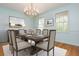 Inviting dining room features wood table, upholstered chairs, and soft pastel walls at 6795 Brandon Mill Rd, Atlanta, GA 30328