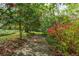 Shaded garden path featuring mature trees and beautiful landscaping at 6795 Brandon Mill Rd, Atlanta, GA 30328