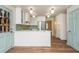 Modern kitchen featuring stainless steel appliances, updated cabinets, and a center island at 6795 Brandon Mill Rd, Atlanta, GA 30328