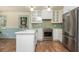 Updated kitchen with stainless steel appliances, white countertops, and ample natural light at 6795 Brandon Mill Rd, Atlanta, GA 30328
