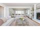Spacious open-concept living room with fireplace, built-ins, and modern furnishings at 6795 Brandon Mill Rd, Atlanta, GA 30328