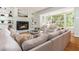 Comfortable living room featuring a cozy fireplace, built-in shelving, and abundant natural light at 6795 Brandon Mill Rd, Atlanta, GA 30328