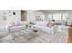 Bright and inviting living room featuring a neutral color palette, stylish furniture, and hardwood floors at 6795 Brandon Mill Rd, Atlanta, GA 30328