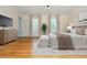 Stylish primary bedroom with hardwood floors, natural light, and cozy décor at 6795 Brandon Mill Rd, Atlanta, GA 30328