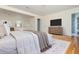 Bright primary bedroom features hardwood floors, neutral tones, and an ensuite bathroom at 6795 Brandon Mill Rd, Atlanta, GA 30328