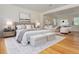 Spacious primary bedroom with hardwood floors, sitting area, and elegant decor at 6795 Brandon Mill Rd, Atlanta, GA 30328