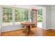 Sunroom with beautiful windows, hardwood floors, natural light and door to outdoors at 6795 Brandon Mill Rd, Atlanta, GA 30328