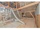 Unfinished attic space with insulation and wooden support beams at 8675 Hope Vine, Roswell, GA 30076