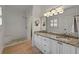 Updated bathroom featuring granite countertops, wood floors, white subway tile, and a tiled shower seat at 8675 Hope Vine, Roswell, GA 30076