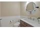 Bathroom with beadboard detail, custom vanity, marble countertop, updated faucet and round mirror at 8675 Hope Vine, Roswell, GA 30076