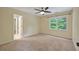 Bedroom with neutral paint, carpeted floors and a window that provides natural light at 8675 Hope Vine, Roswell, GA 30076