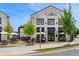 Charming cafe exterior with outdoor seating, inviting patrons to enjoy a meal in a pleasant environment at 8675 Hope Vine, Roswell, GA 30076