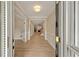 Inviting foyer with hardwood floors and views of the living spaces at 8675 Hope Vine, Roswell, GA 30076