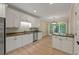 Open-concept kitchen with stainless appliances and an adjacent dining area at 8675 Hope Vine, Roswell, GA 30076