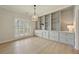 Bright living room featuring custom built-ins, ample storage, and stylish lighting at 8675 Hope Vine, Roswell, GA 30076