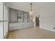 Bright living room featuring custom built-ins, ample storage, and stylish lighting at 8675 Hope Vine, Roswell, GA 30076