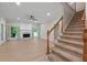 Bright living room featuring wood floors, fireplace, neutral paint, open windows and carpeted staircase at 8675 Hope Vine, Roswell, GA 30076