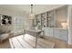 Bright home office featuring built-in shelving, hardwood floors, and neutral decor at 8675 Hope Vine, Roswell, GA 30076