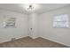 Bright bedroom featuring two windows and neutral carpet, creating a comfortable and inviting space at 2378 Green Forrest Dr, Decatur, GA 30032