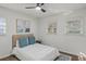 Serene bedroom with soft bedding, three windows, and stylish decor creating a restful and inviting retreat at 2378 Green Forrest Dr, Decatur, GA 30032