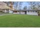 Charming single-story home with a neatly manicured lawn and classic brick accents at 2378 Green Forrest Dr, Decatur, GA 30032