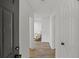 Bright and airy hallway with hardwood floors, leading to a comfortably furnished living space at 2378 Green Forrest Dr, Decatur, GA 30032
