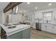 Bright kitchen with white cabinets, modern appliances, large island, and eat in table space at 2378 Green Forrest Dr, Decatur, GA 30032