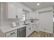 Well-lit kitchen with white cabinets, stainless steel appliances, and modern countertops at 2378 Green Forrest Dr, Decatur, GA 30032
