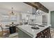 Bright and airy kitchen featuring a large island with barstools and modern finishes at 2378 Green Forrest Dr, Decatur, GA 30032
