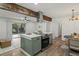 Well-equipped kitchen island features sleek appliances and dining space with bright windows and a sliding glass door at 2378 Green Forrest Dr, Decatur, GA 30032
