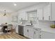 Modern eat-in kitchen featuring white cabinets, stainless steel appliances, and modern island at 2378 Green Forrest Dr, Decatur, GA 30032
