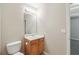Bathroom featuring toilet, sink with wooden vanity, and large mirror at 2896 Chilhowee Dr, Atlanta, GA 30331