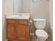 Small bathroom featuring a toilet and sink with vanity cabinet and towel rack at 2896 Chilhowee Dr, Atlanta, GA 30331