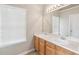 Bathroom with double sink vanity, large mirror, and modern lighting at 2896 Chilhowee Dr, Atlanta, GA 30331