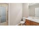 Half-bath featuring a toilet and sink with wood cabinet and tile flooring at 2896 Chilhowee Dr, Atlanta, GA 30331