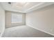 Bright and open bedroom with soft carpet, light gray walls, and recessed ceiling at 2896 Chilhowee Dr, Atlanta, GA 30331