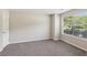 Bright bedroom with carpet, a window providing natural light, and a door to the closet at 2896 Chilhowee Dr, Atlanta, GA 30331