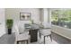 Formal dining room featuring glass table, seating for eight, and large window at 2896 Chilhowee Dr, Atlanta, GA 30331