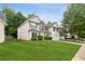 Two-story home showing the side view, featuring a manicured lawn, attached garage, and partial view of the street at 2896 Chilhowee Dr, Atlanta, GA 30331