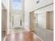 Bright foyer with a high ceiling, wooden and carpet flooring, and a view into the adjacent living space at 2896 Chilhowee Dr, Atlanta, GA 30331